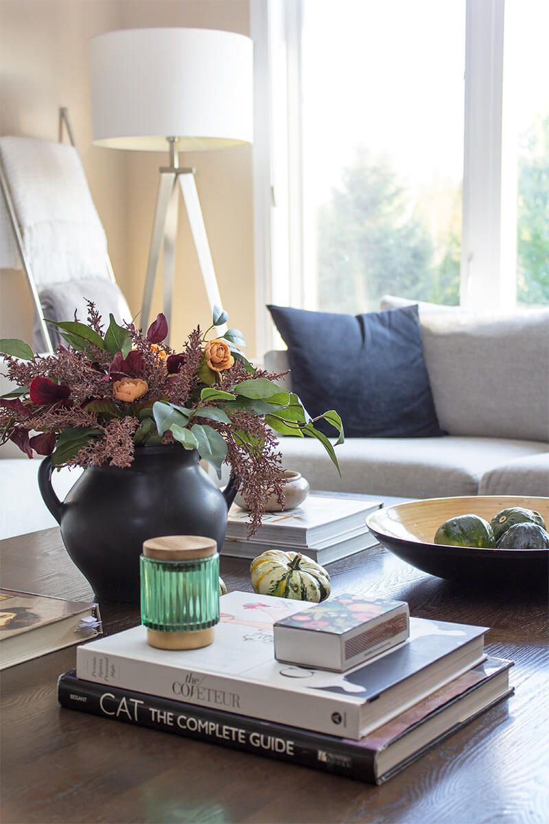 Stack colorful books on a side table