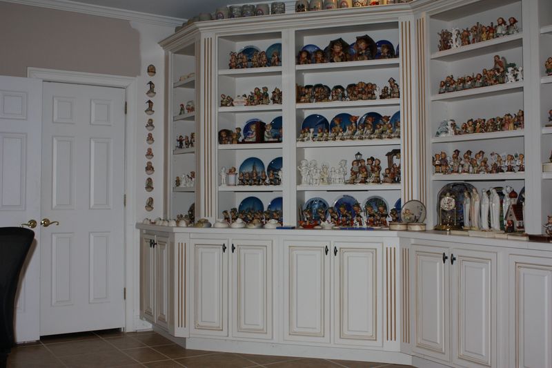 Formal china cabinets stuffed with collectibles
